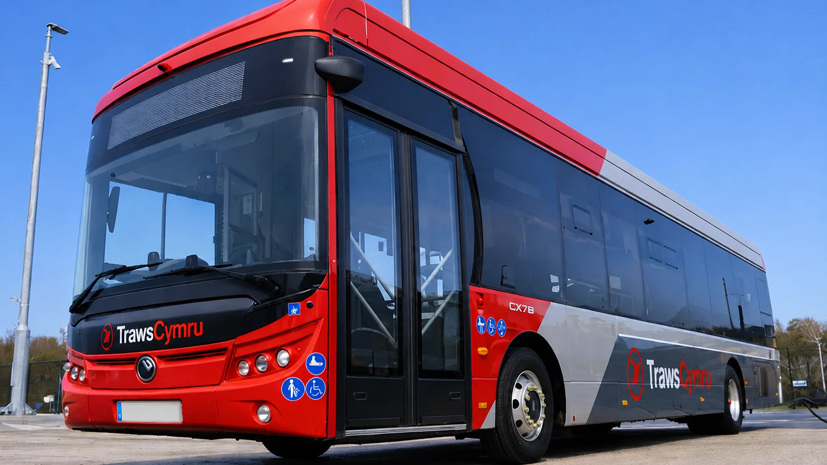 A red TrawsCymru service bus at a stop